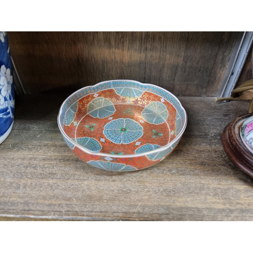 1474 - A Chinese blue and white prunus jar and cover, 26cm high; together with a famille rose lamp bas... 