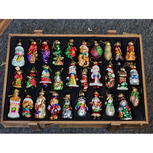 1504 - A good collection of Thomas Pacconi 2004 30th anniversary Christmas decorations, in four pine c... 