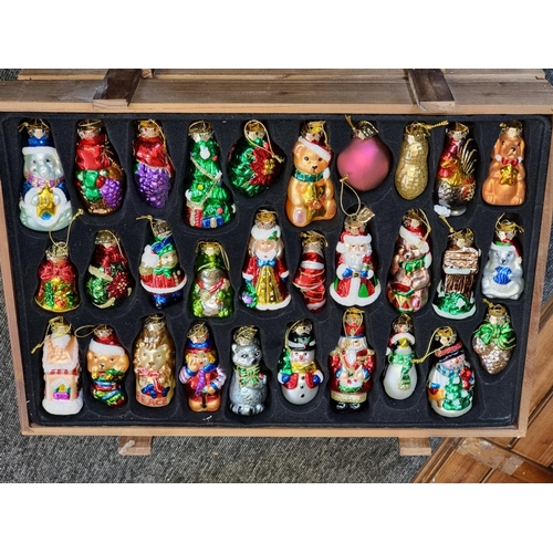 1504 - A good collection of Thomas Pacconi 2004 30th anniversary Christmas decorations, in four pine c... 