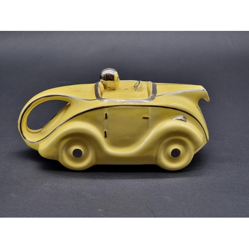 1536 - An Art Deco style Sadler pottery novelty racing car teapot and cover.