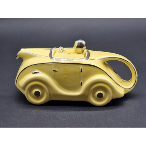 1536 - An Art Deco style Sadler pottery novelty racing car teapot and cover.