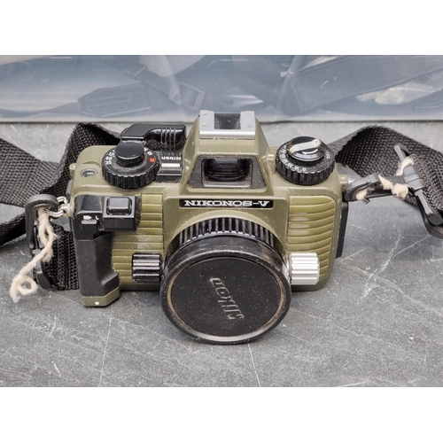 1561 - Cameras: a collection of underwater equipment, comprising two Nikonos-V cameras, each with Nikk... 