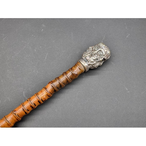 1599 - An unusual antique rootwood cane, the silver plated multi-faced terminal inscribed '146 New Bond St'... 