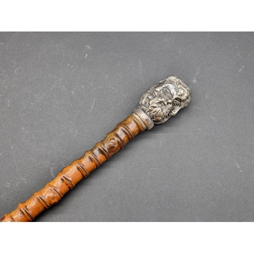 1599 - An unusual antique rootwood cane, the silver plated multi-faced terminal inscribed '146 New Bond St'... 