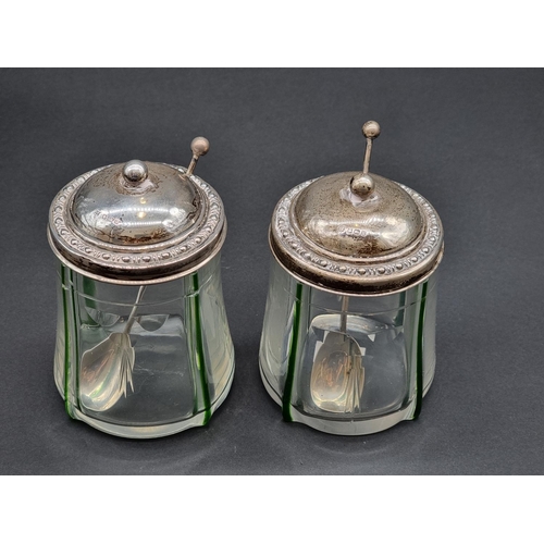 1636 - A pair of silver lidded glass preserve jars, Sheffield 1912, 13cm high, with a pair of matching silv... 