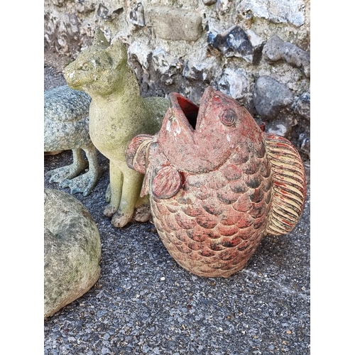 1653 - Two composition stone cats, largest 36.5cm high; together with a similar sleeping dog; a potter... 