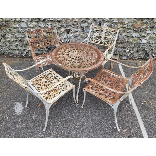 1654 - A set of four cast iron garden armchairs, 50.5cm wide; together with a similar table, 69.5cm diamete... 