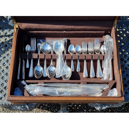 1657 - A canteen of electroplated bead pattern cutlery for eight, by Harrods.