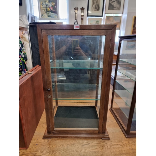 1099 - A mahogany table top display cabinet, 81cm high x 52cm wide x 43cm deep, with two keys.... 