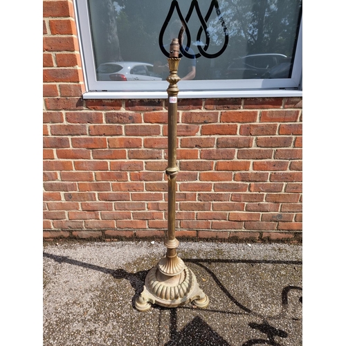 1123 - An old brass adjustable standard lamp.