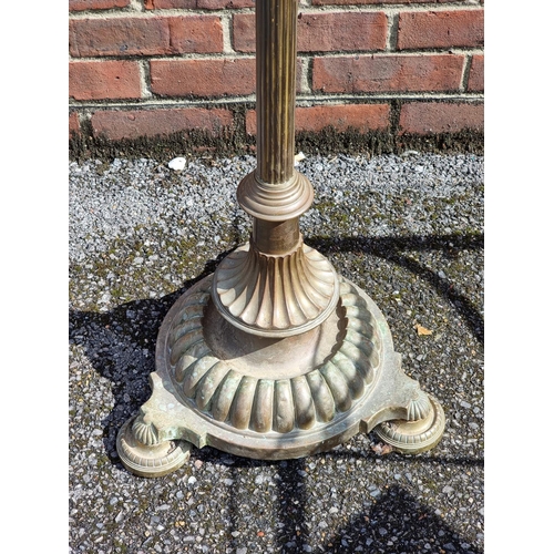 1123 - An old brass adjustable standard lamp.