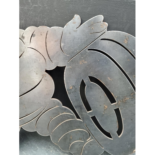 1620 - A 4mm sheet steel Michelin Man plaque, 63cm high x 76cm wide.