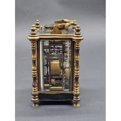 1135A - A brass carriage clock, with alarm and push button repeat, height including handle 21cm.... 