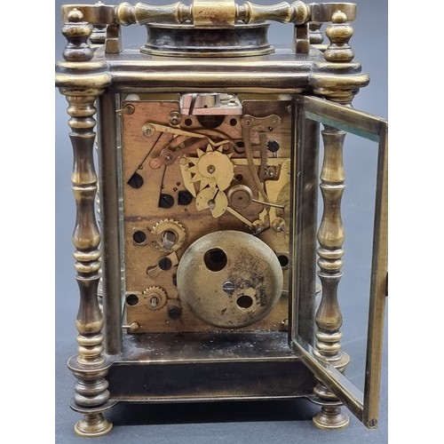 1135A - A brass carriage clock, with alarm and push button repeat, height including handle 21cm.... 