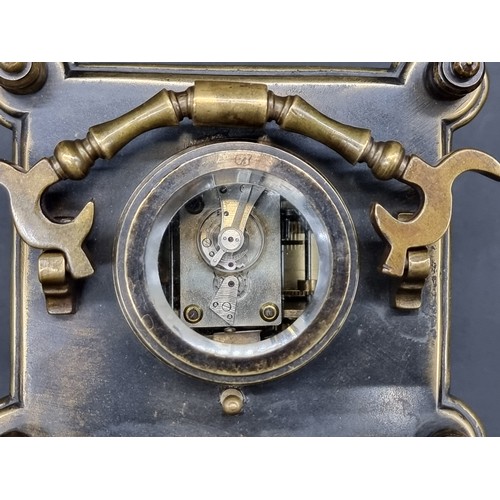 1135A - A brass carriage clock, with alarm and push button repeat, height including handle 21cm.... 