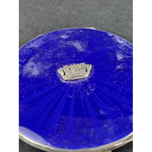 102 - An engine turned silver and guilloche enamel compact, by John William Barrett, Birmingham 1939, 7.6c... 