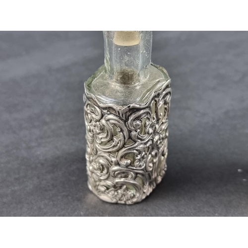 105 - An Edwardian silver mounted scent bottle, by Levi & Salaman, Birmingham 1904, 8cm high; together... 