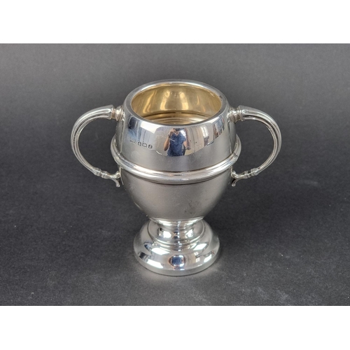 11 - A silver twin handled vase, by Walker & Hall, Birmingham 1933, 11cm high, 125g.... 