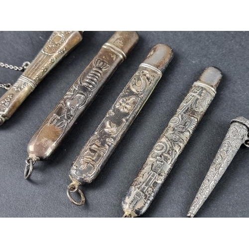 110 - Four white metal pendant bodkin cases, stamped sterling; together with another similar bodkin case, ... 