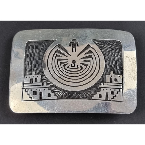 113 - An Aztec style belt buckle, stamped 'Suzi Sterling 950 Silver', 8 x 5.5cm wide.