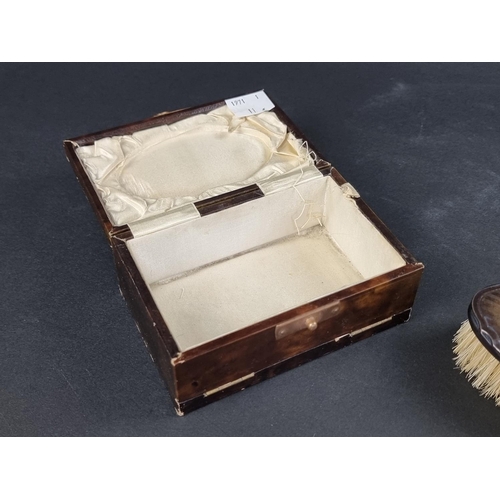 118 - A cased silver mounted brush; together with a leather mounted mirror.