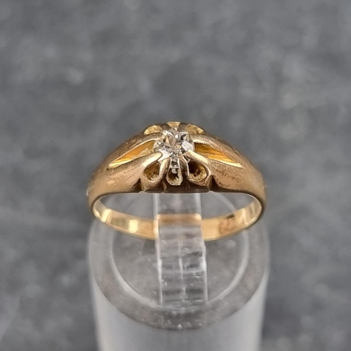 125 - A yellow metal diamond set gypsy ring.