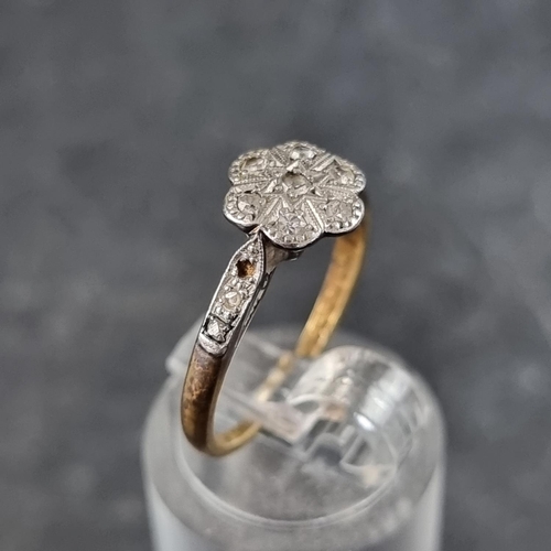 126 - A 18ct gold and platinum diamond daisy ring, size K 1/2, gross weight 2.3g.