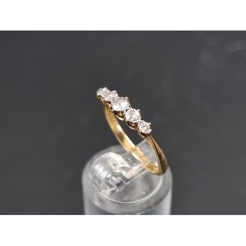 129A - A yellow metal diamond five stone ring, stamped 18ct/Plat, size M 1/2.