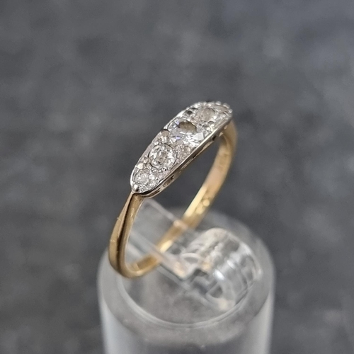 133 - A yellow metal diamond five stone ring, stamped 18ct, set central old cut diamond and four single cu... 