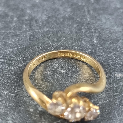 136 - An 18ct gold diamond three stone ring, the principal stone approximately 0.25ct, size L, Chester 190... 