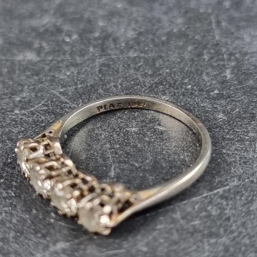 137 - An Edwardian white metal and diamond four stone ring, stamped '18ct/Plat', size L 1/2.... 