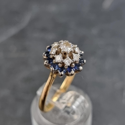 147 - An 18ct gold diamond and sapphire cluster ring, set nine diamonds and twelve sapphires, London 1966,... 