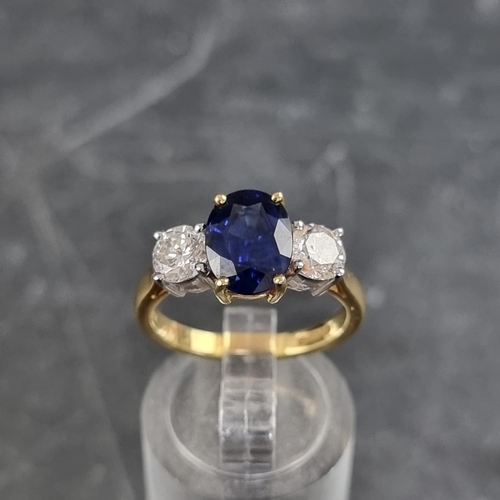 149 - A modern 18ct gold diamond and sapphire three stone ring, set central oval sapphire with a brilliant... 