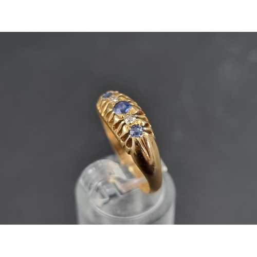 154A - An 18ct gold diamond and sapphire five stone ring, Birmingham 1921, size M 1/2, gross weight 2.4g.... 