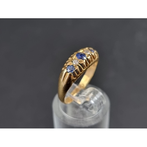 154A - An 18ct gold diamond and sapphire five stone ring, Birmingham 1921, size M 1/2, gross weight 2.4g.... 