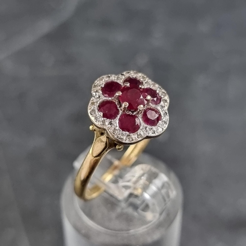 156 - An 18ct gold ruby and diamond floral cluster ring, set seven rubies and multiple small diamonds, siz... 