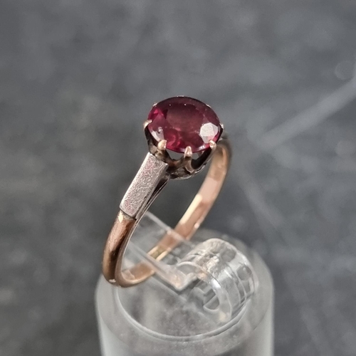 163 - A yellow metal ruby ring, stamped 9ct. size M.