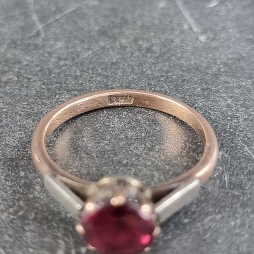 163 - A yellow metal ruby ring, stamped 9ct. size M.