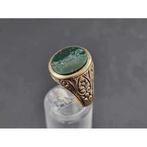 170A - A 9ct gold signet ring set oval intaglio carved bloodstone, size Q, gross weight 6.4g.... 