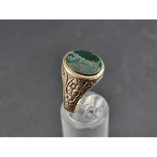 170A - A 9ct gold signet ring set oval intaglio carved bloodstone, size Q, gross weight 6.4g.... 