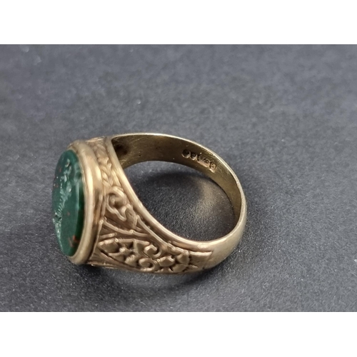 170A - A 9ct gold signet ring set oval intaglio carved bloodstone, size Q, gross weight 6.4g.... 