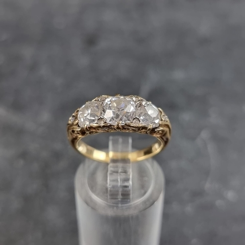 193 - A late Victorian yellow metal diamond half hoop ring, set three old cut diamonds and six small rose ... 