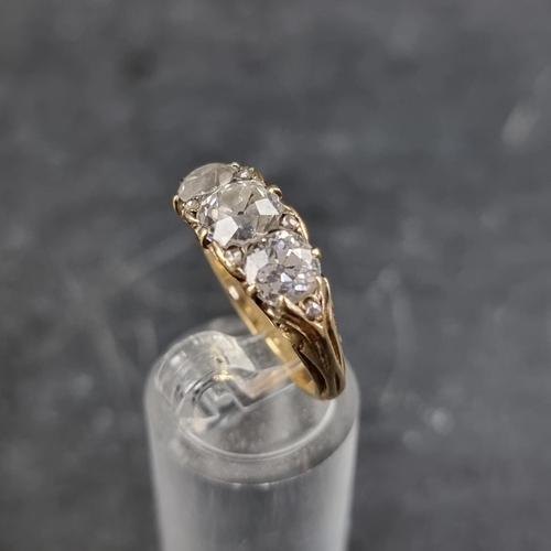 193 - A late Victorian yellow metal diamond half hoop ring, set three old cut diamonds and six small rose ... 