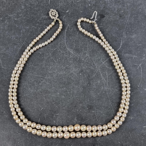 195 - A cased 'Rosita' cultured pearl necklace, having 9ct white gold clasp inset one diamond chip, 39cm.... 