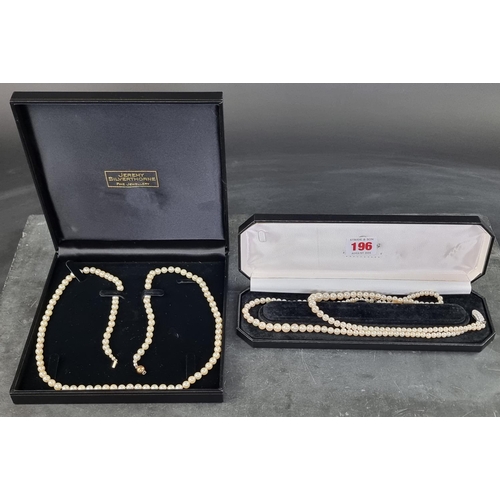 196 - A cased cultured pearl necklace, having clasp stamped 925, approximately 41cm long; together with an... 