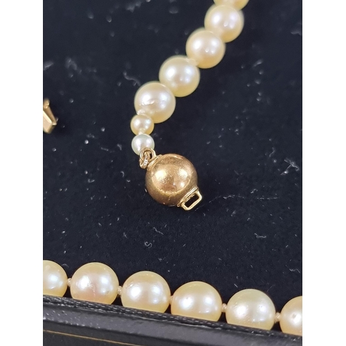 196 - A cased cultured pearl necklace, having clasp stamped 925, approximately 41cm long; together with an... 