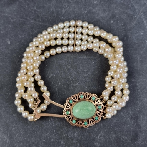 201 - A cultured pearl five strand bracelet, having 9ct gold clasp inset turquoises, by J.R, Birmingham 19... 