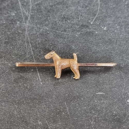 203 - A yellow metal 'terrier' tie pin, by J G & S, stamped 9ct, cased.