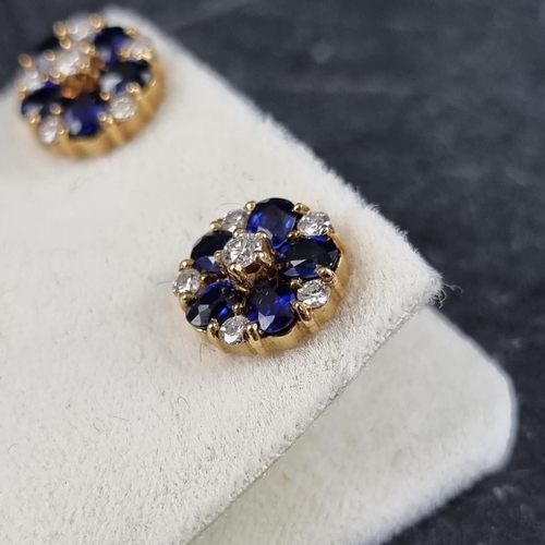 204 - A pair of 18ct gold sapphire and diamond floral cluster ear studs, each set six brilliant cut diamon... 