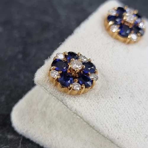 204 - A pair of 18ct gold sapphire and diamond floral cluster ear studs, each set six brilliant cut diamon... 